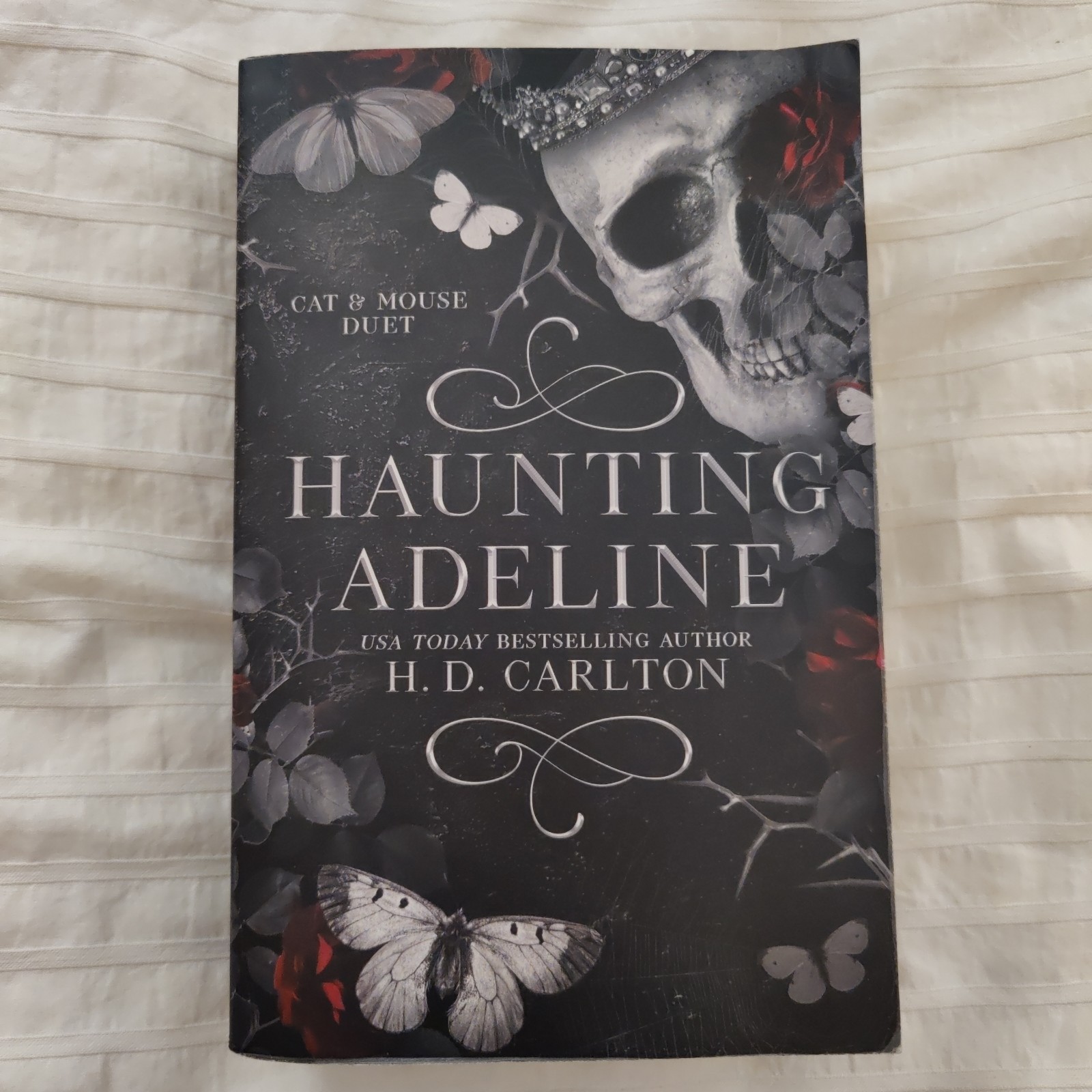 Haunting Adeline By H. D. Carlton. Paperback. ISBN # 9781638932468.