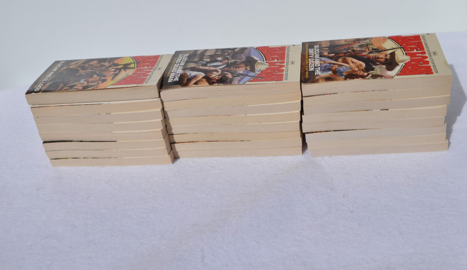 Lot of 24 John Slocum Westerns by Jake Logan-#361 to #393; March 2009-Nov. 2011