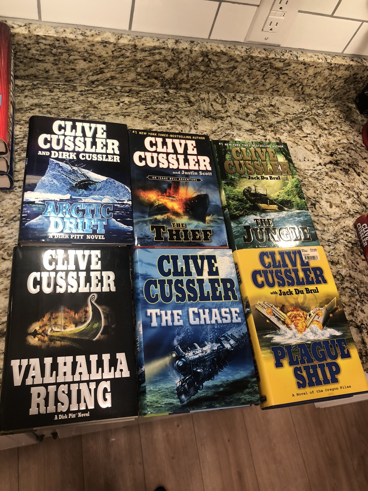 Clive Cussler Hardcover Books Lot of 27 See Photos for Titles Excellent Conditio
