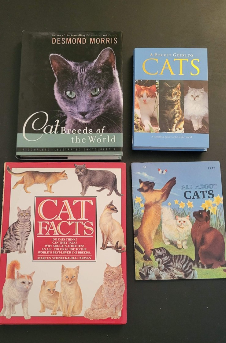 Lot 4 assorted books about cat breeds and facts