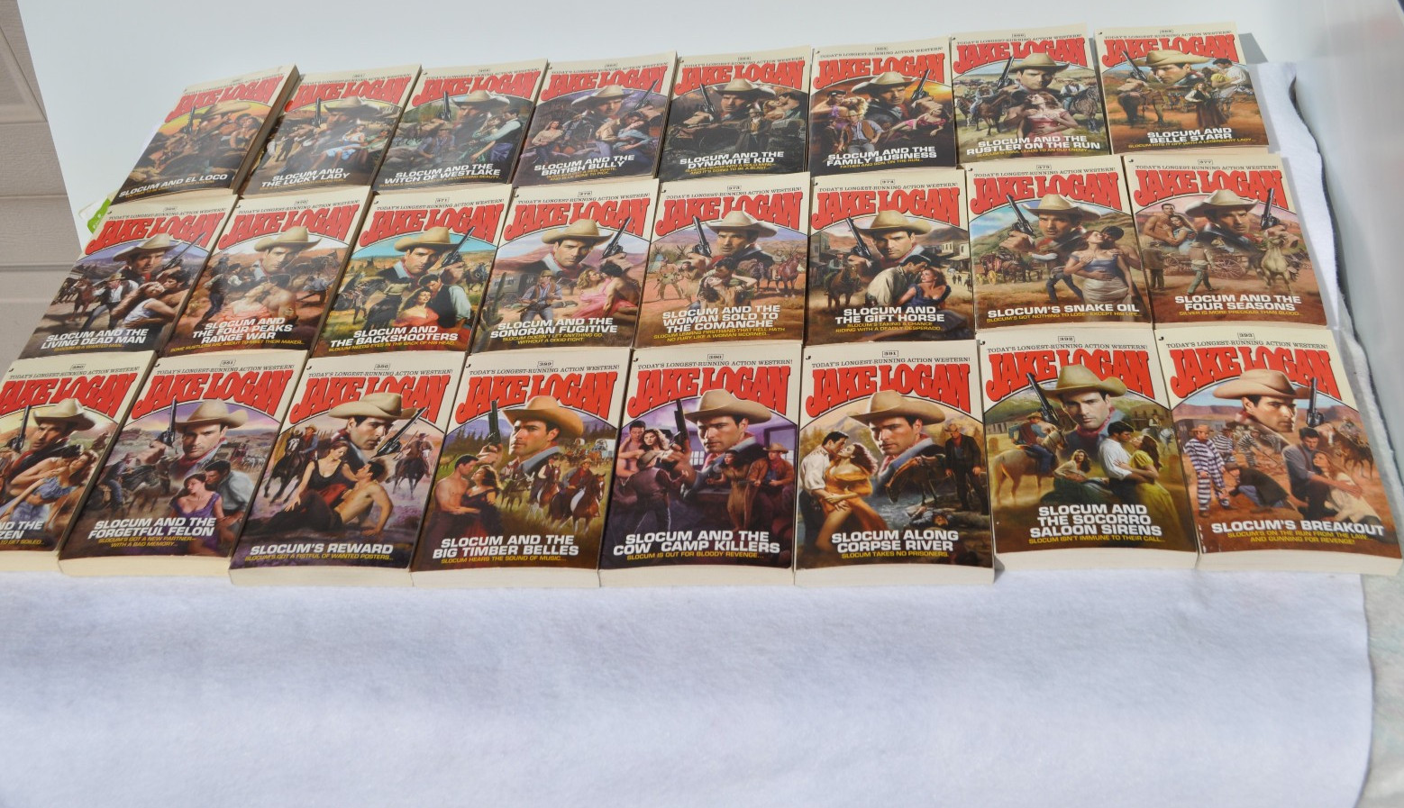 Lot of 24 John Slocum Westerns by Jake Logan-#361 to #393; March 2009-Nov. 2011