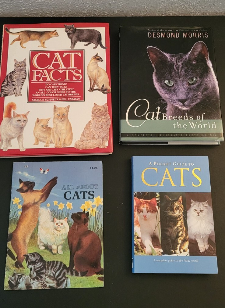 Lot 4 assorted books about cat breeds and facts