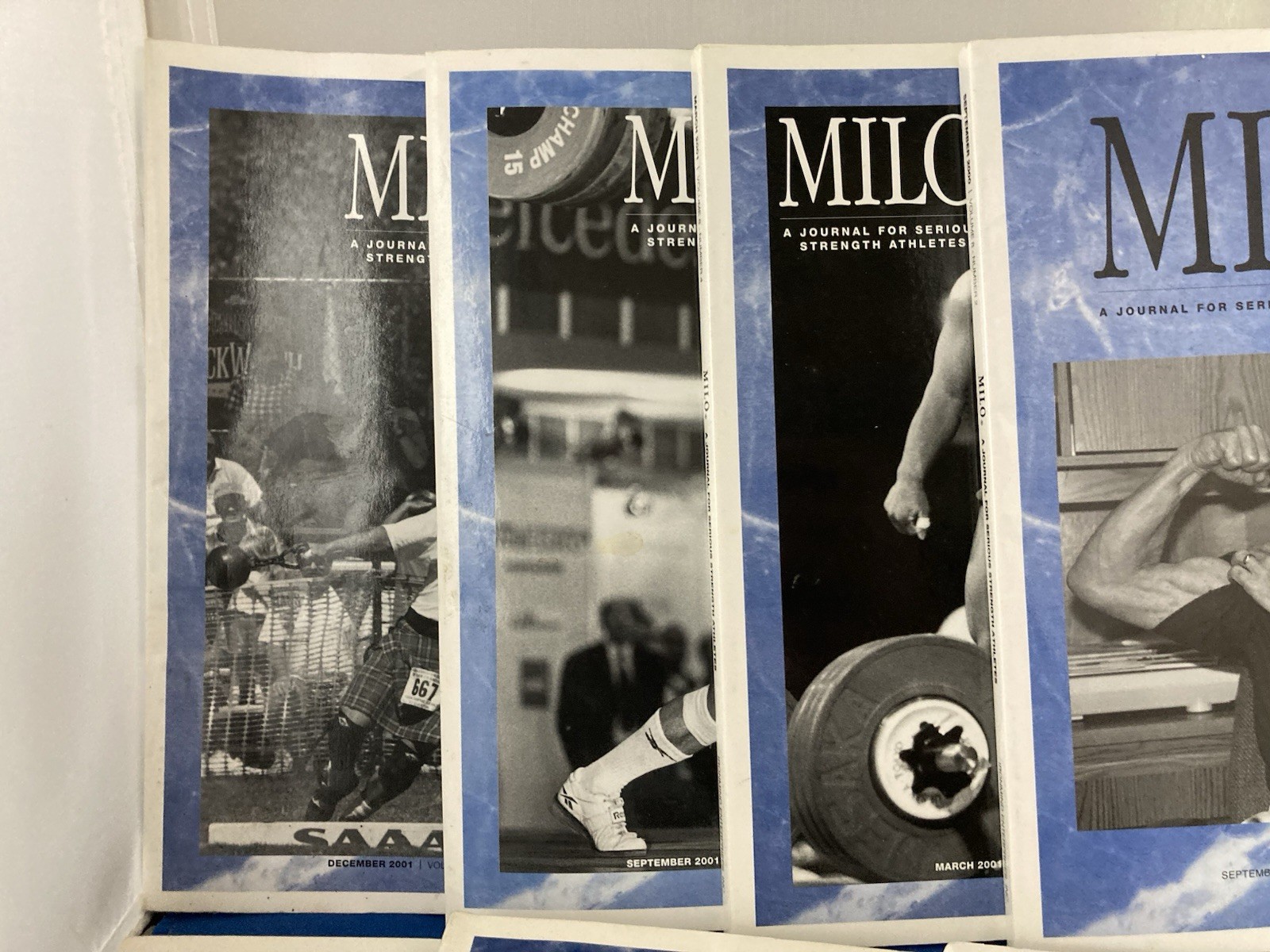 WEIGHTLIFTING-MILO JOURNALS FOR SERIOUS STRENGTH ATHLETES. LOT OF 7. 2000-2001