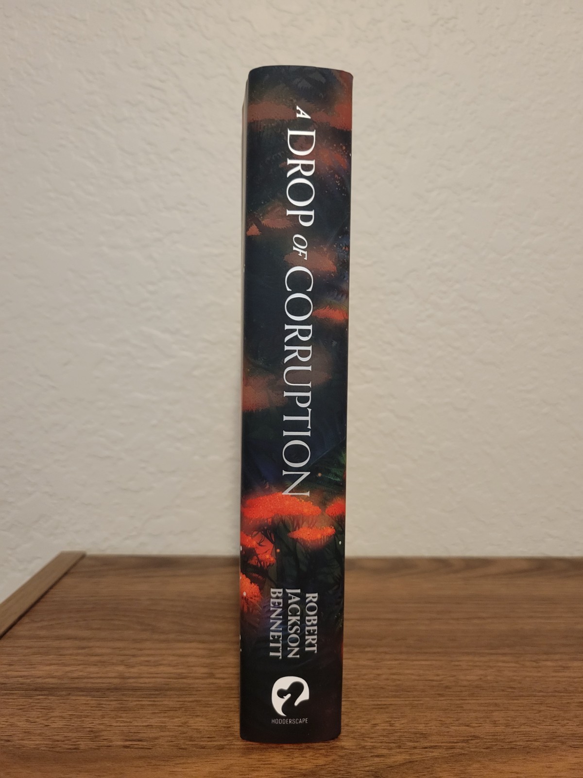A Drop Of Corruption by Robert Jackson Bennett – Broken Binding Unsigned Edition