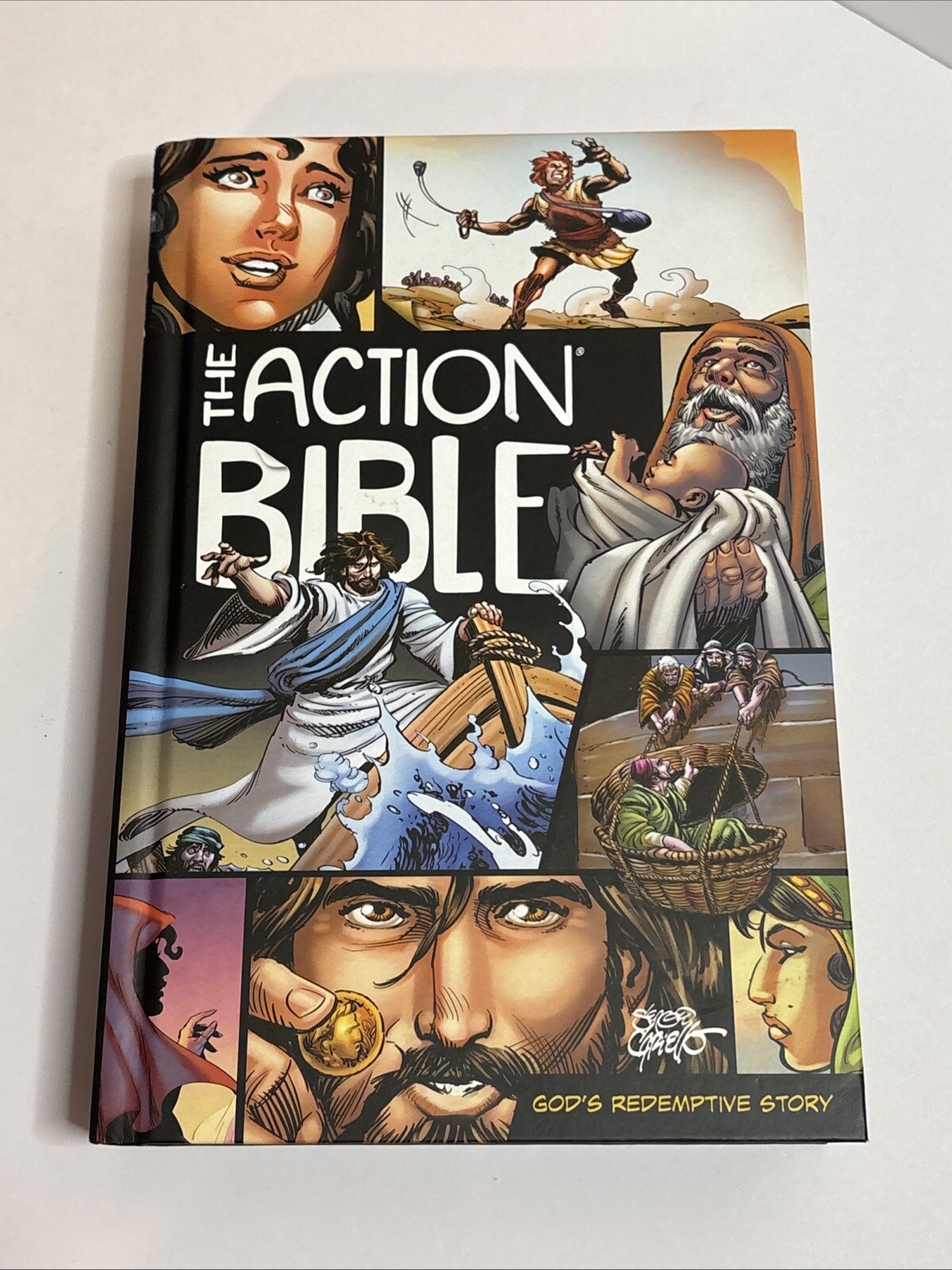 The Action Bible: God’s Redemptive Story by Sergio Cariello Hardcover