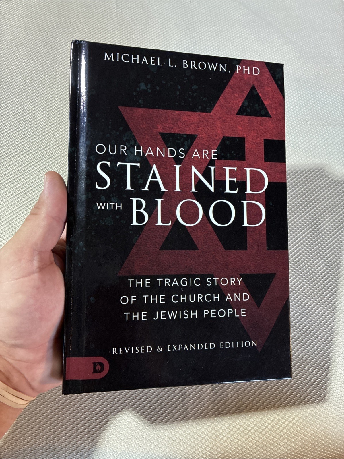 Our Hands Are Stained with Blood Revised and Expanded : The Tragic Story of the