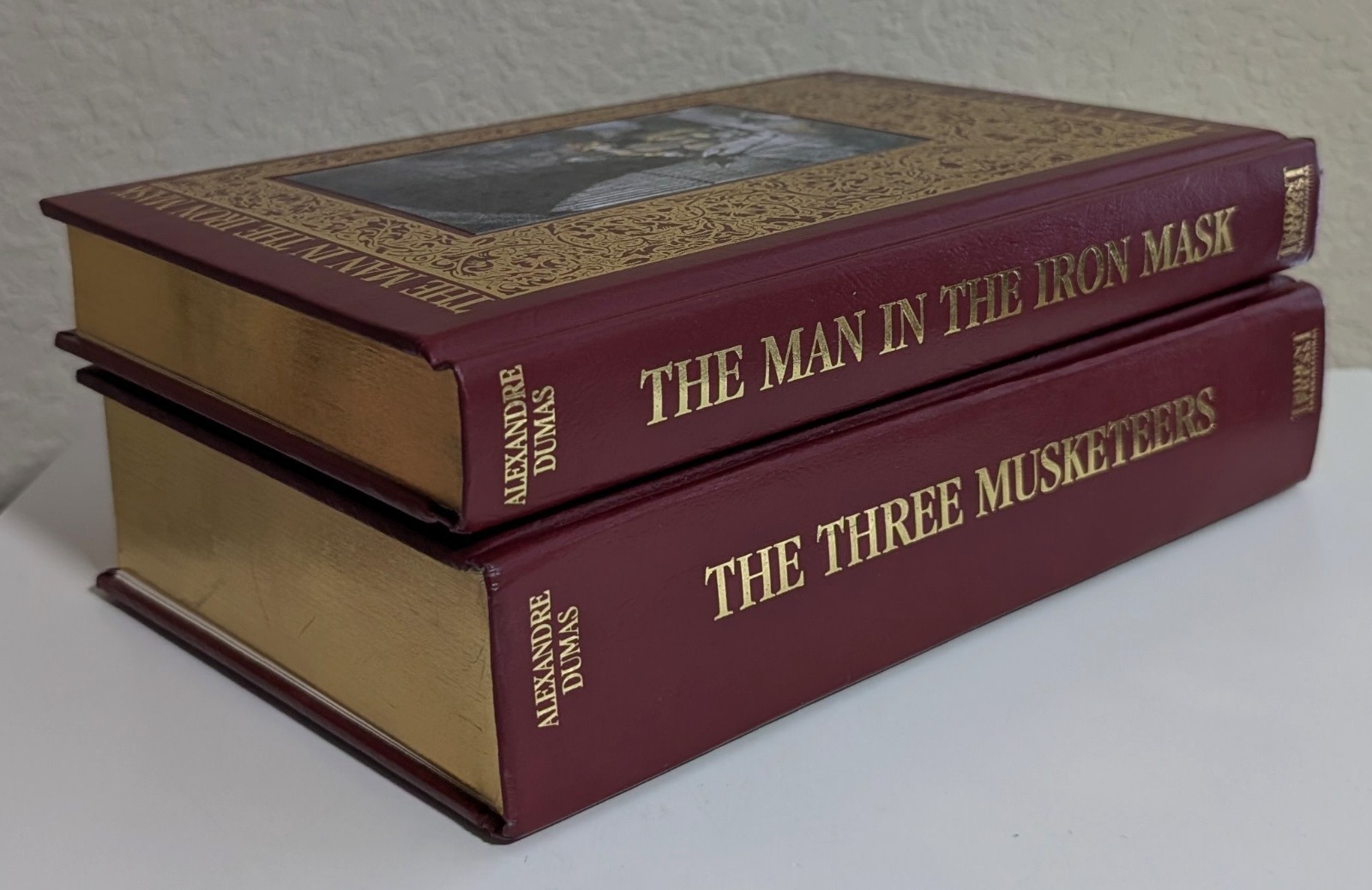 Alexandre Dumas = THREE MUSKETEERS + MAN IN THE IRON MASK = 2 padded leather HC