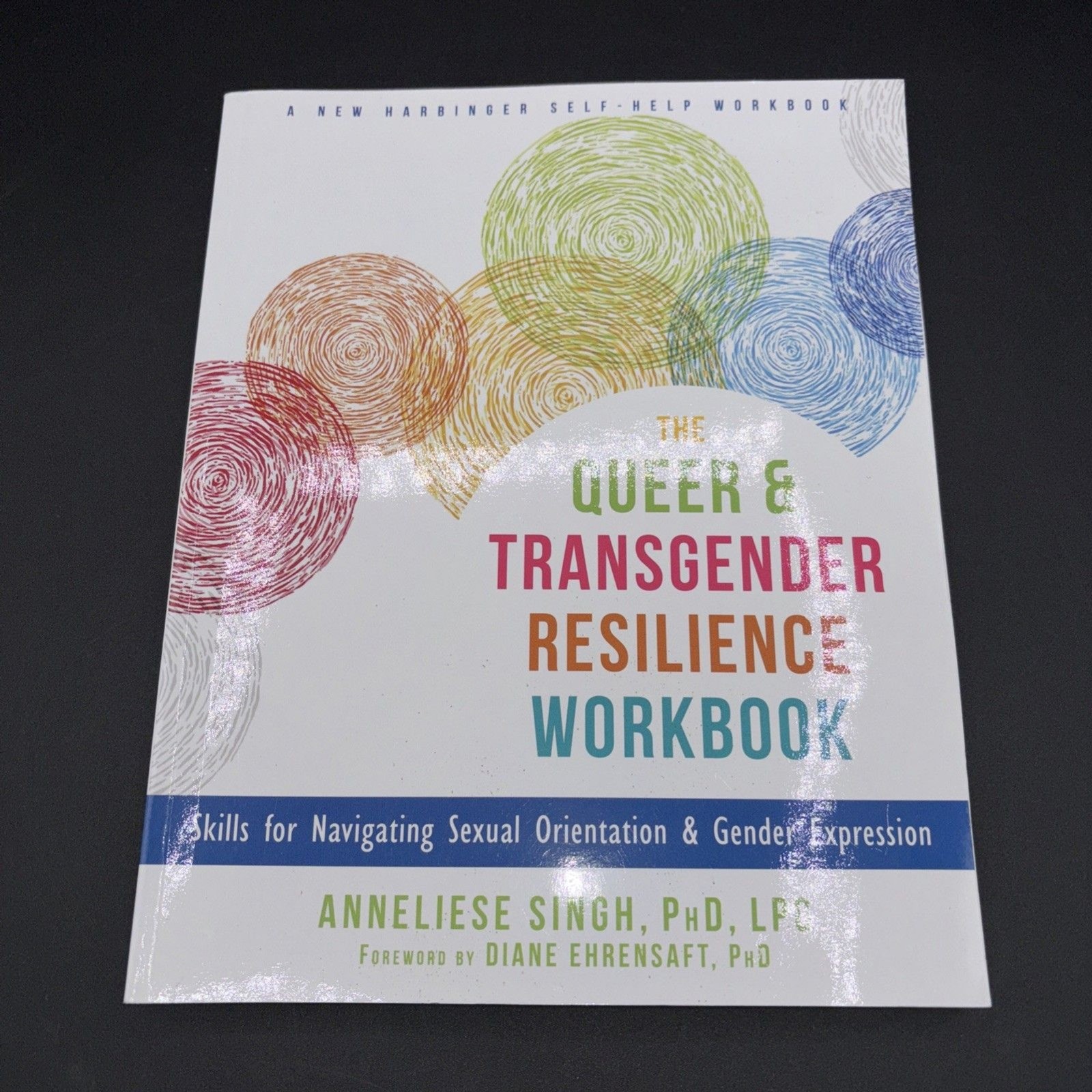 The Queer and Transgender Resilience Workbook : Skills for Navigating Gender