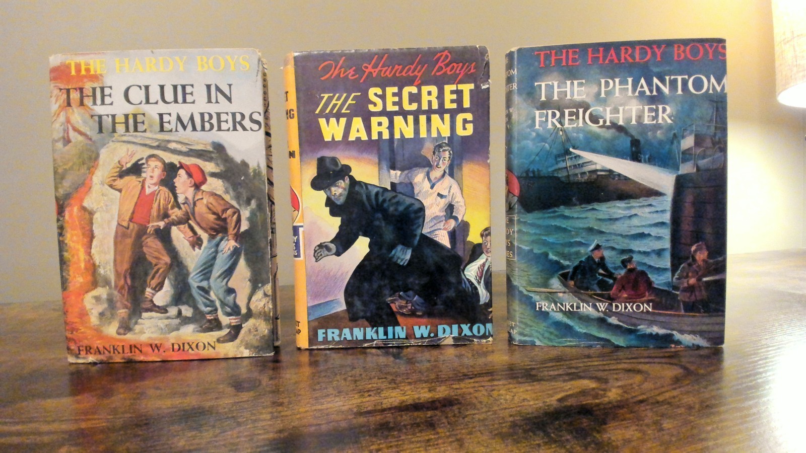 3 Vintage Hardy Boy Books – HCDJ – The Secret Warning, The Phantom Freighter, ..