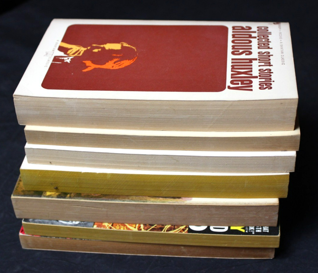 7 VINTAGE ALDOUS HUXLEY PAPERBACK BOOKS: BRAVE NEW WORLD, ISLAND, APE & ESSENCE
