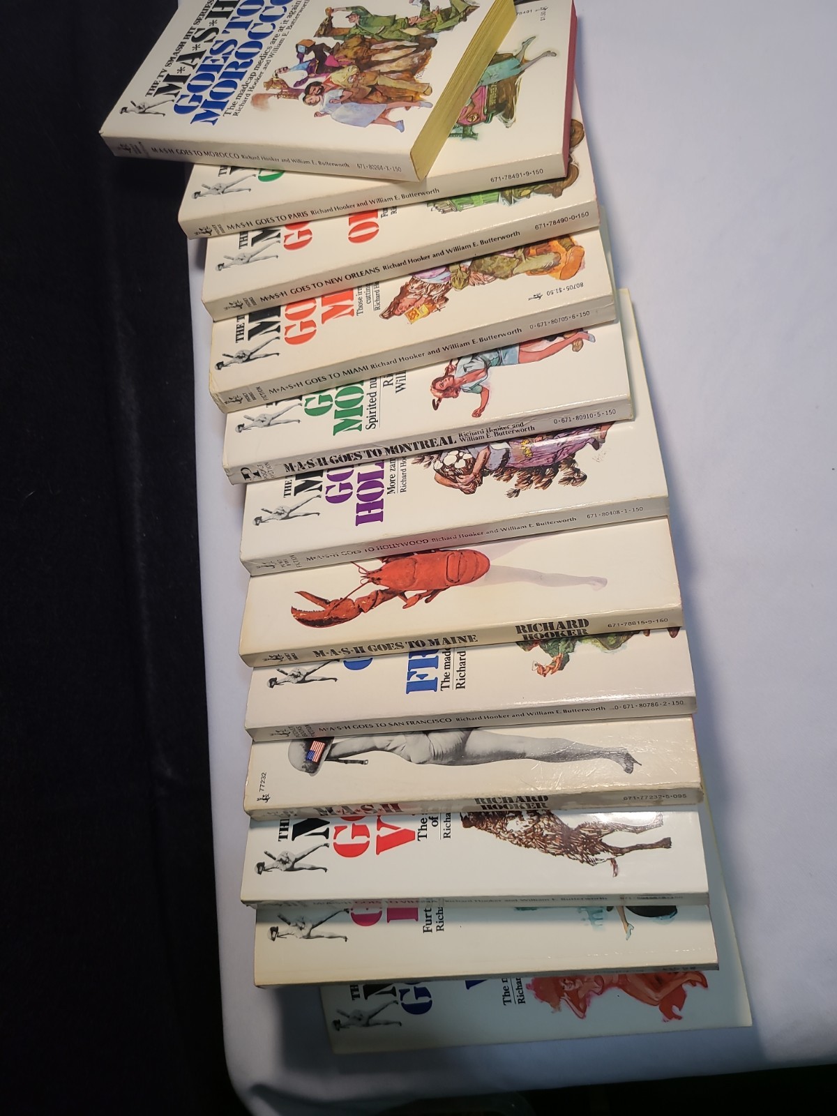 12x 1970s MASH Goes To Paperback Books Miami Paris Vienna Paris London ++ Hooker