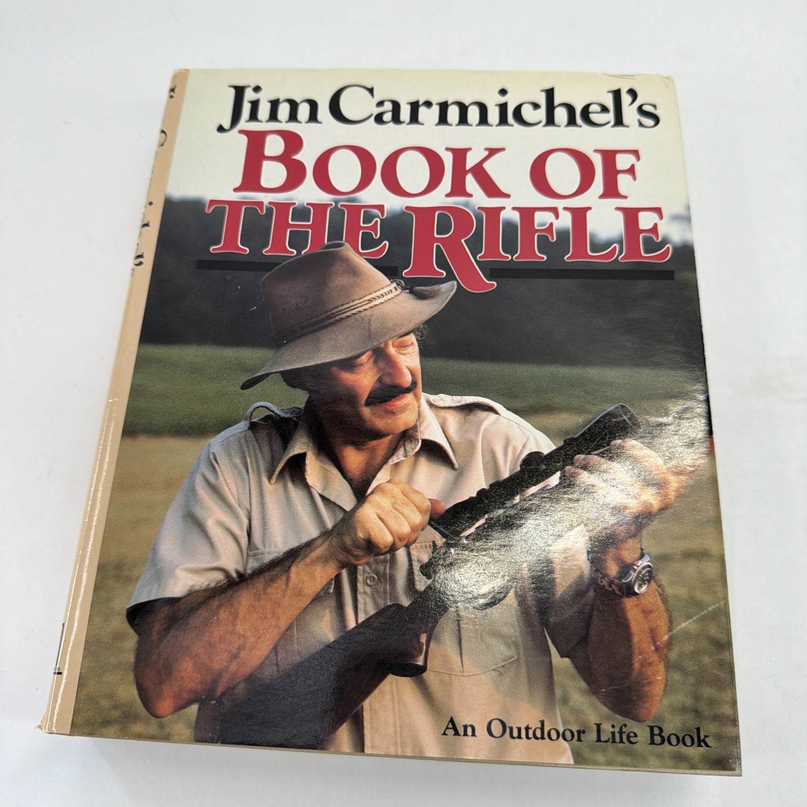 Jim Carmichael’s Book of the Rifle. First Edition HC/DJ, 1985. Reference