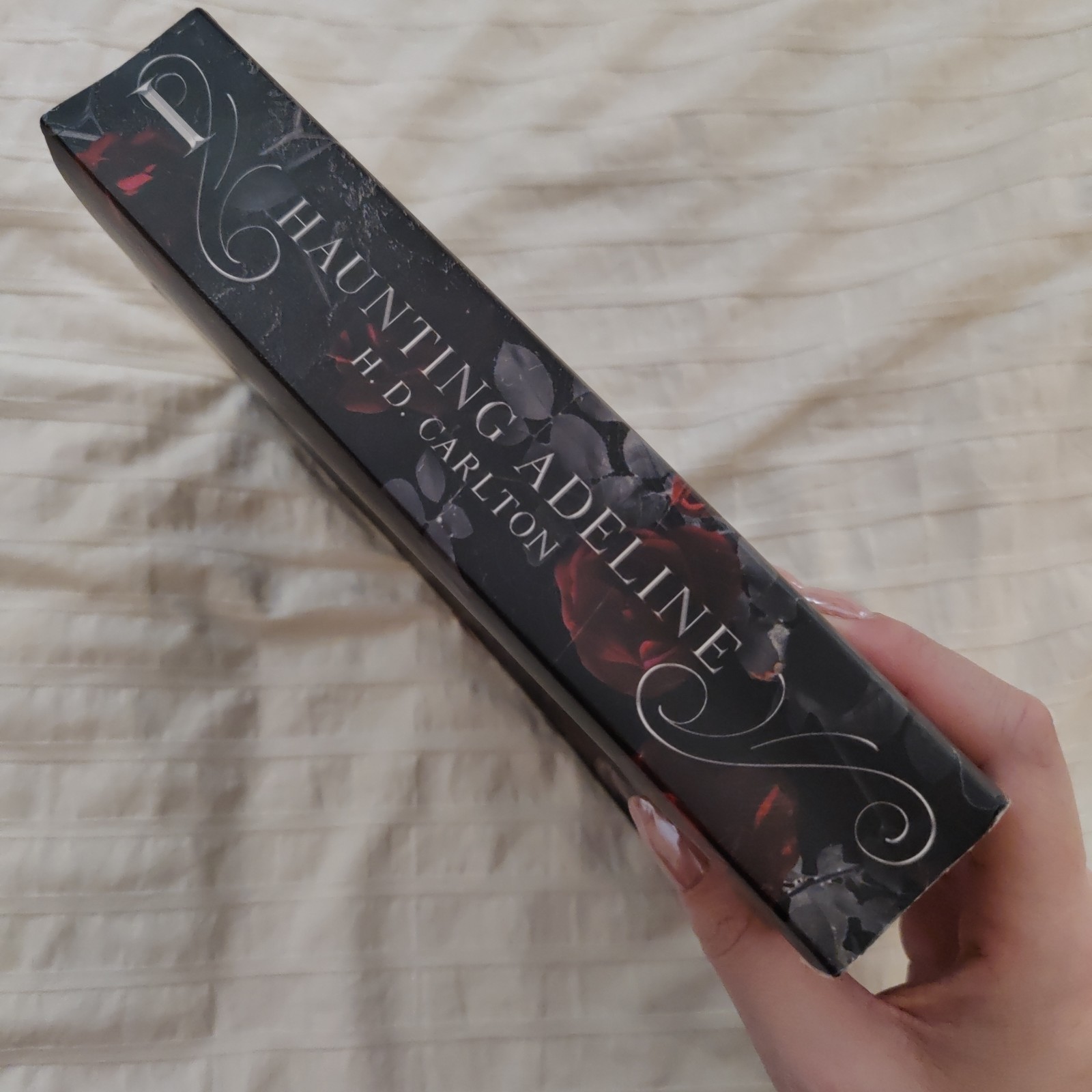 Haunting Adeline By H. D. Carlton. Paperback. ISBN # 9781638932468.
