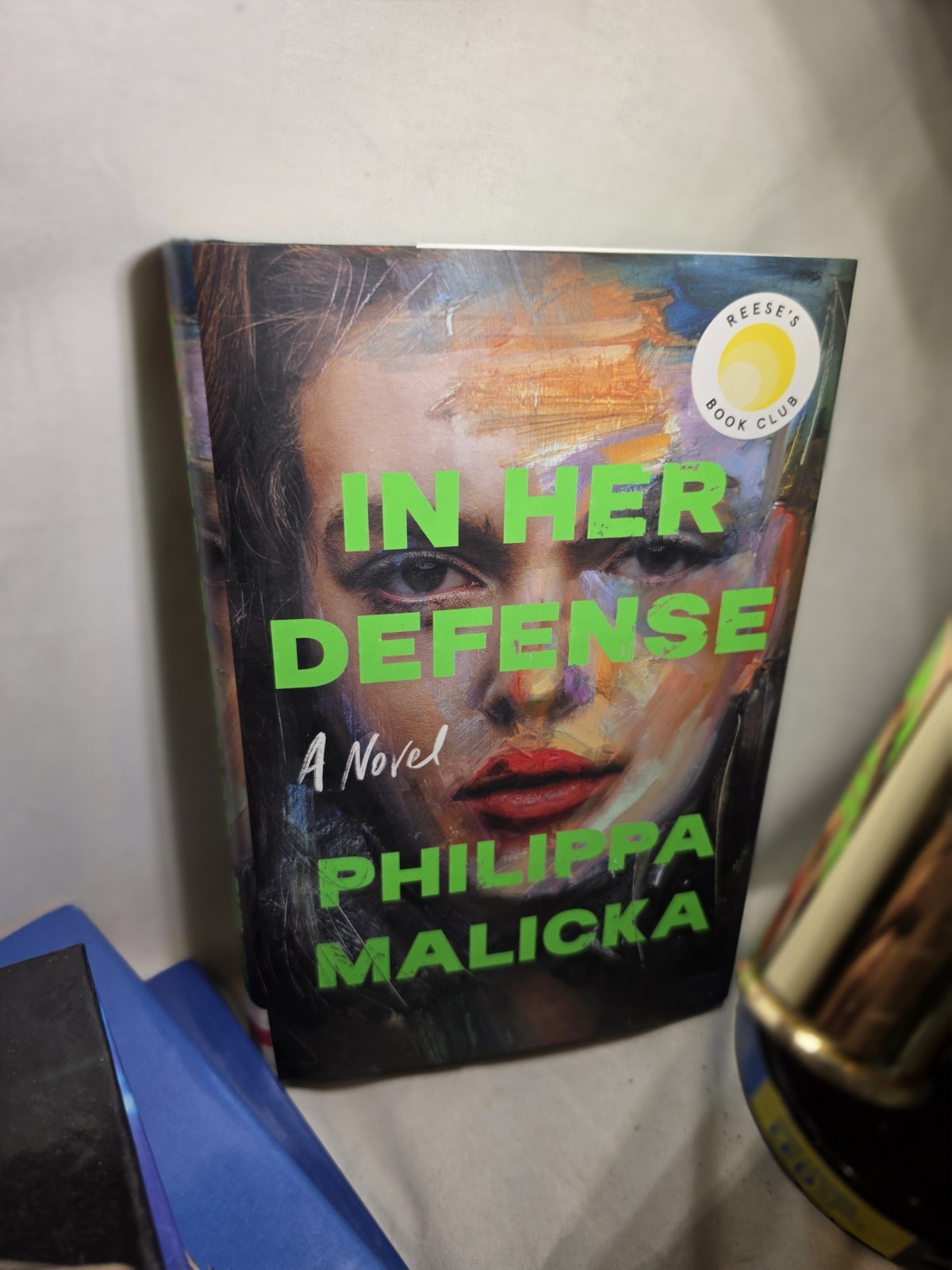 In Her Defense by Philippa Malicka NEW Hardcover/Dust Jacket Reese’s Book Club